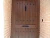 Puerta de calle PVC imitación madera panel IP3 CLAVOS